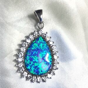 SOLD
 sterling silver lab created opal pendant
I